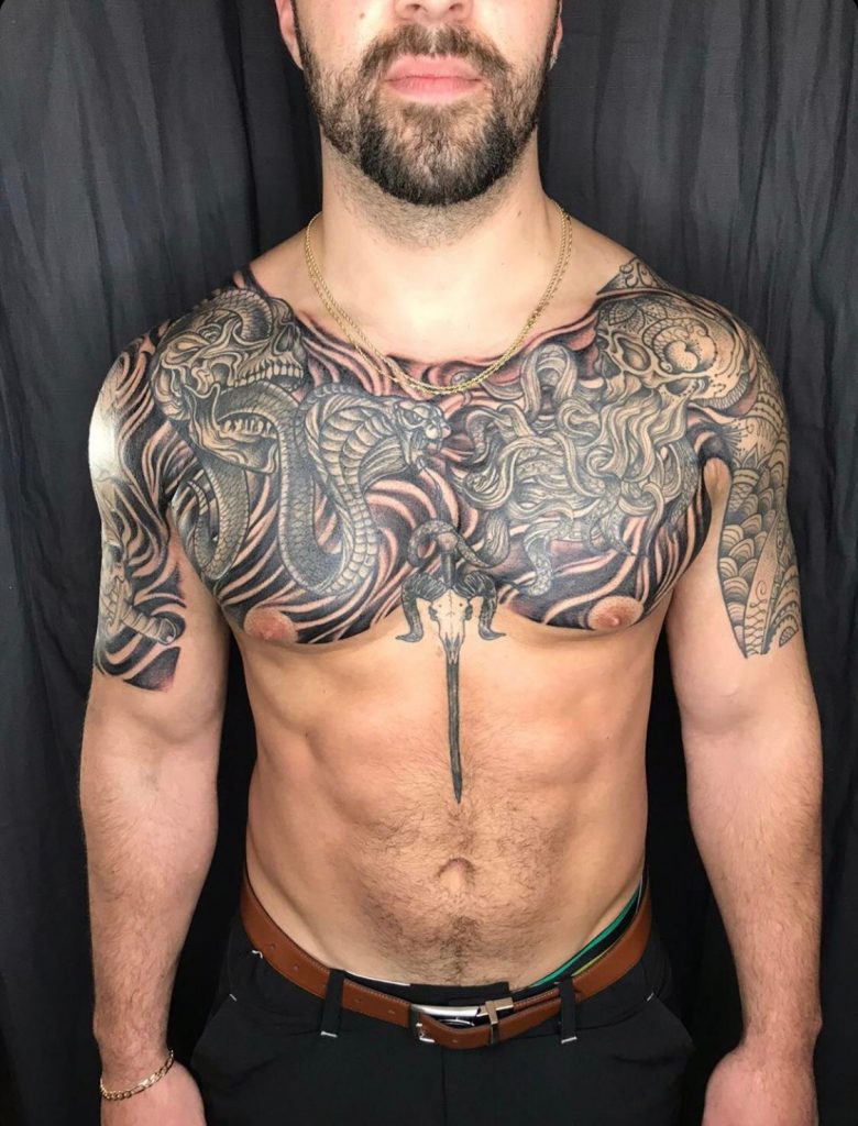 black and grey chest tattoo